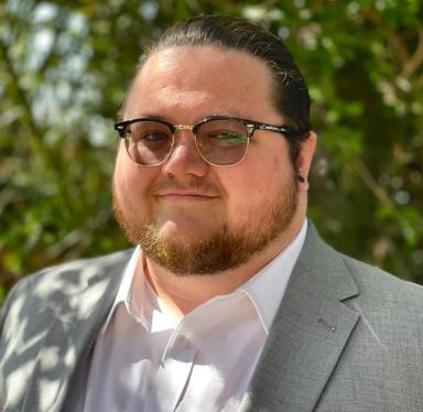 Professional headshot of Henry Phillips, Software Engineer and Cloud Security Consultant